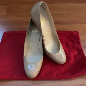 Nude round toe Christian Louboutin pumps